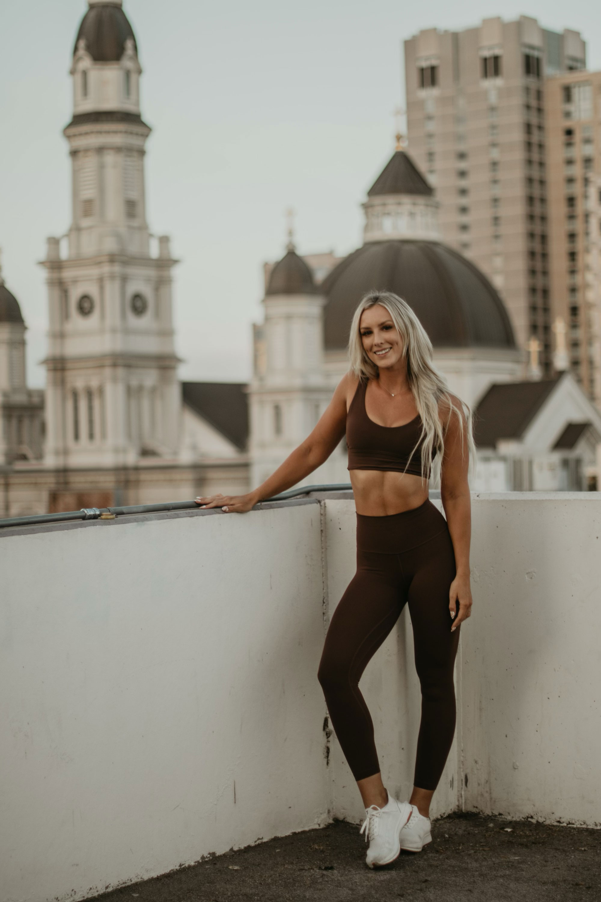 Coach posing on a rooftop